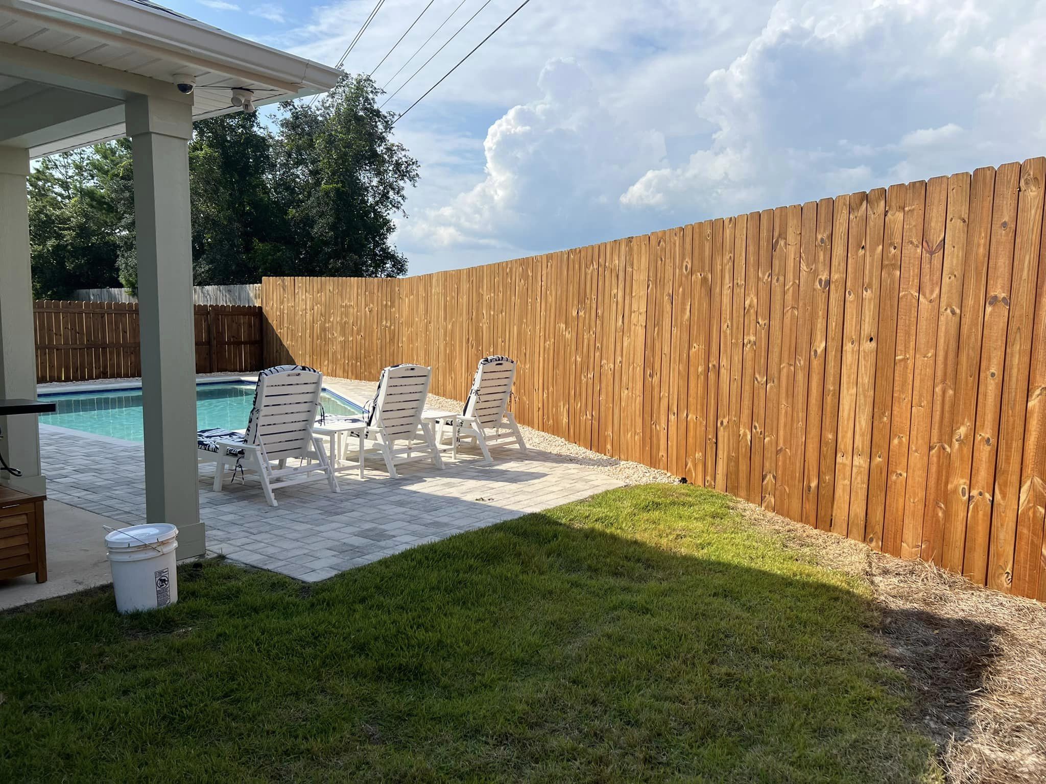 Fence and deck washing and staining. Outstanding job